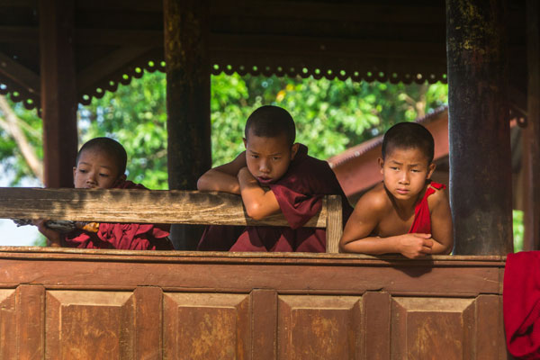 Children leaning on a window